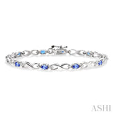 4x3mm Oval Cut Tanzanite and 1/10 Ctw Round Cut Diamond Bracelet in 10K White Gold