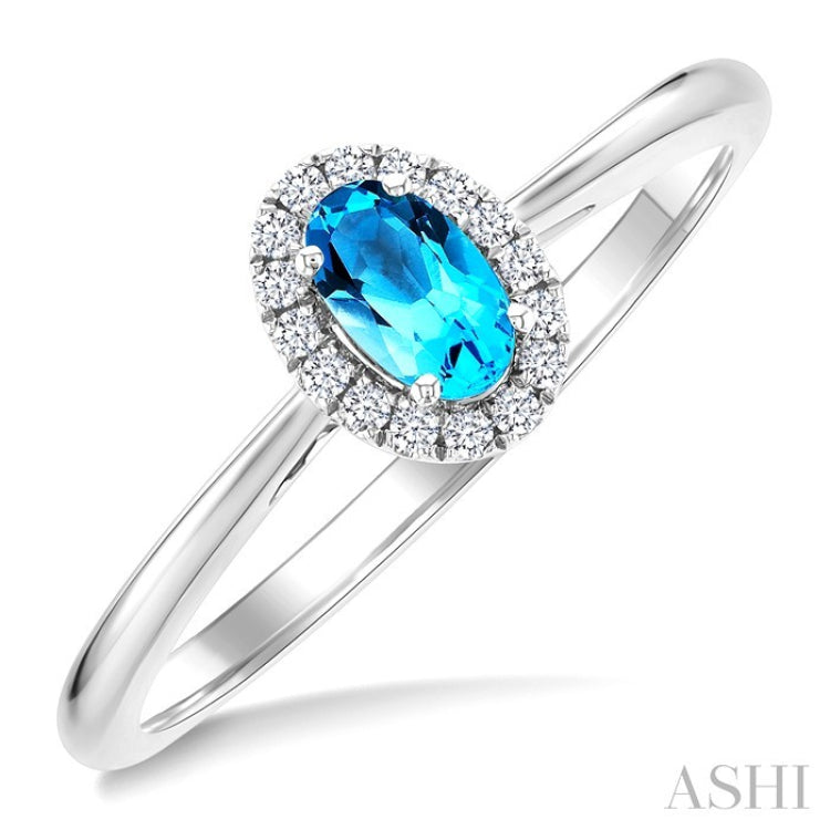 5x3 MM Oval Shape Blue Topaz and 1/20 Ctw Round Cut Diamond Halo Semi-Precious Ring in 10K White Gold
