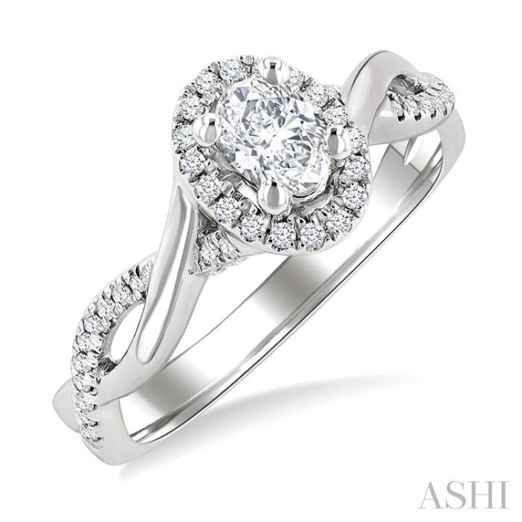1/2 Ctw Twisted Shank Round Cut Diamond Halo Engagement Ring With 1/3 Ct Oval Cut Diamond Center Stone in 14K White Gold