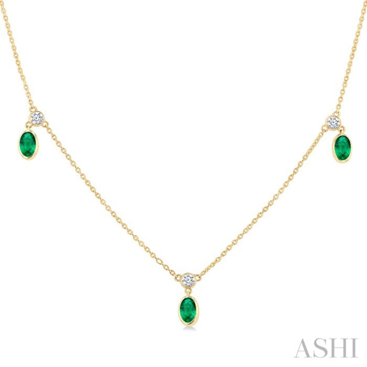 5x3 MM Oval Shape Emerald and 1/8 Ctw Round Cut Diamonds Precious Station Necklace in 10K Yellow Gold