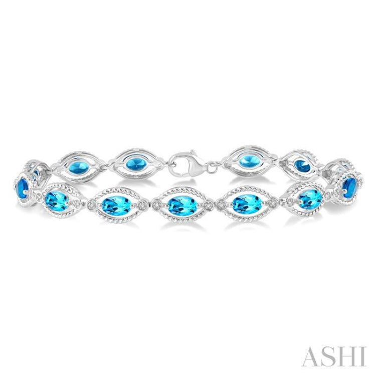 6x4 MM Oval Cut Blue Topaz and 1/10 Ctw Round Cut Diamond Semi-Precious Bracelet in Sterling Silver